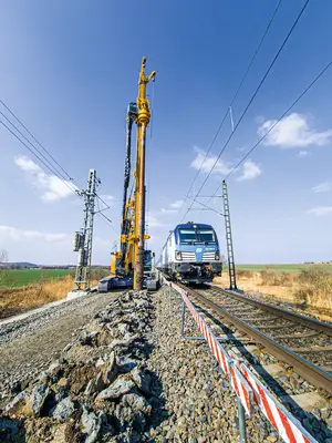 BAUER BG 23 H drilling rig during pre-drilling work for gravel columns for soil stabilization in Czech Republic